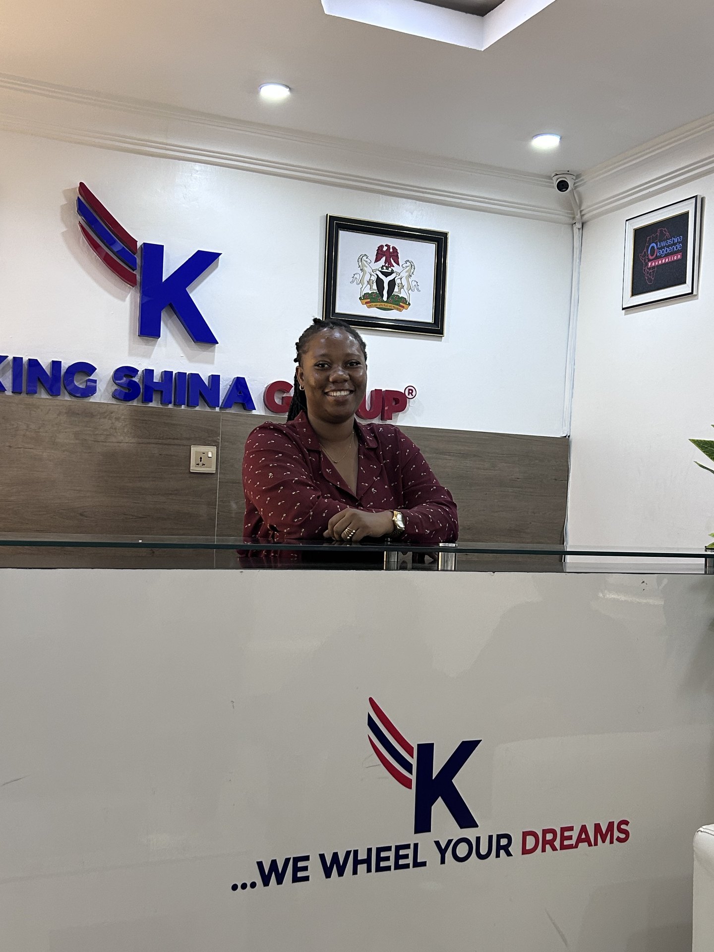 A member of the firm welcoming visitors from the reception desk