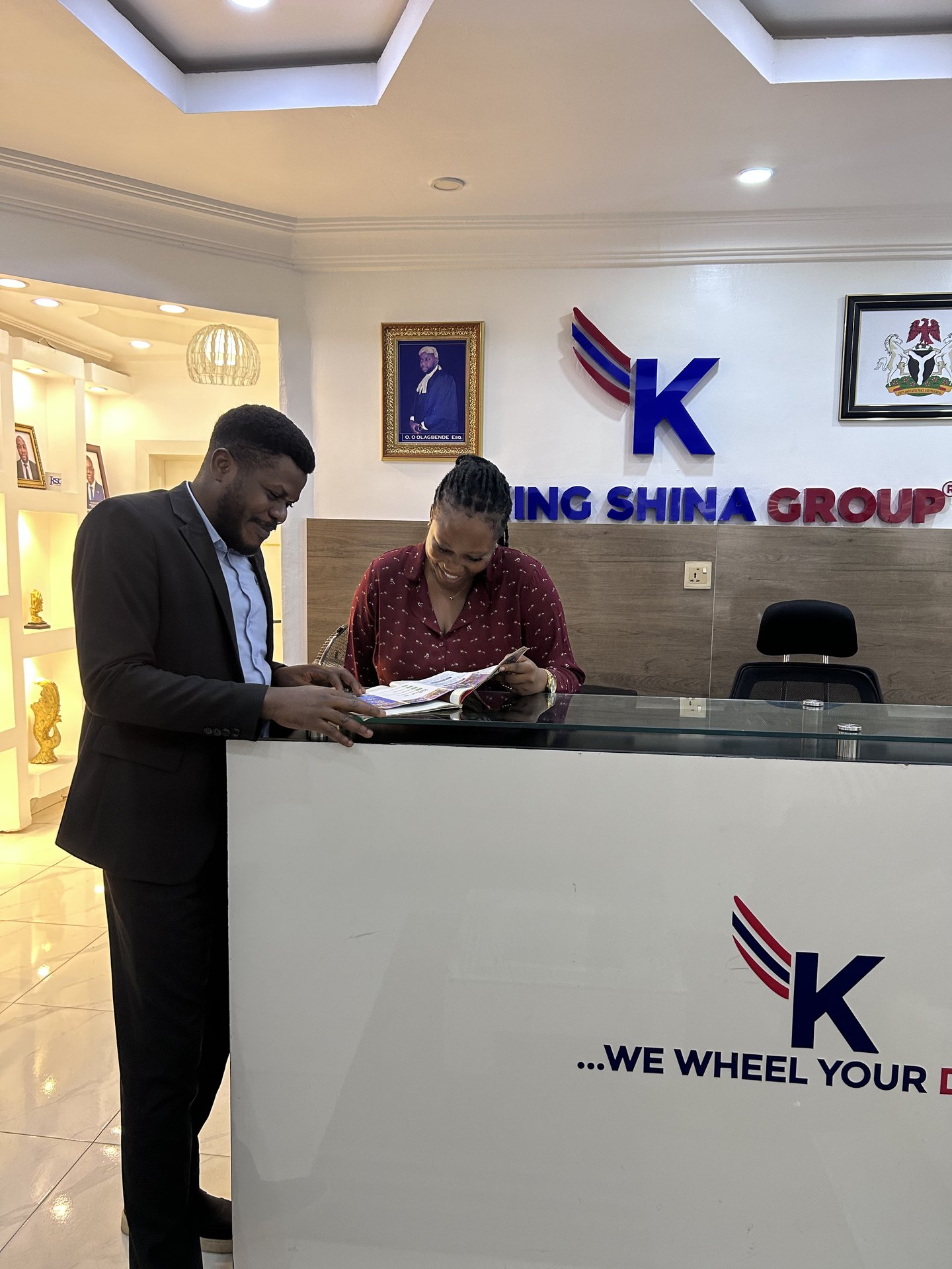 Counsel going through a printed brief with a colleague at the reception desk
